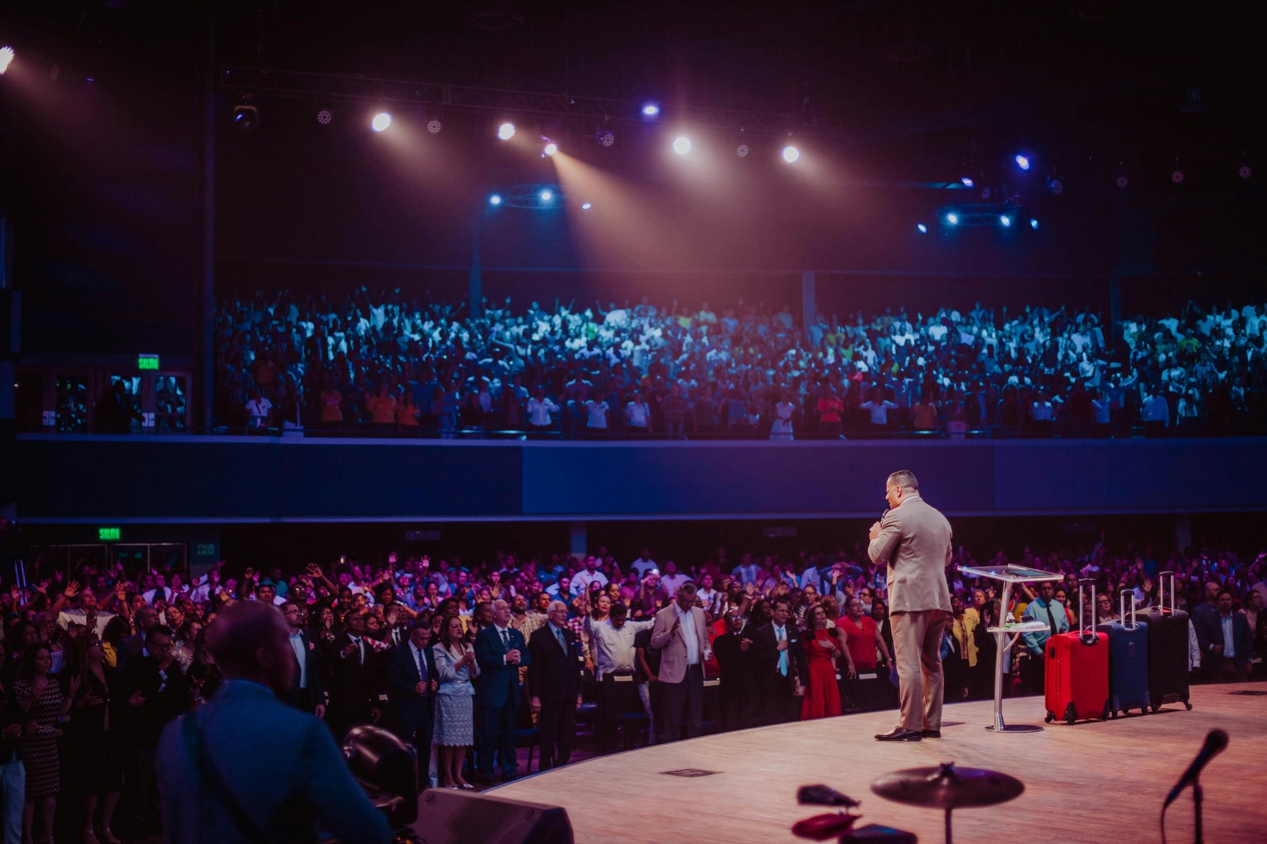 Conference audience and keynote stage at a large business event